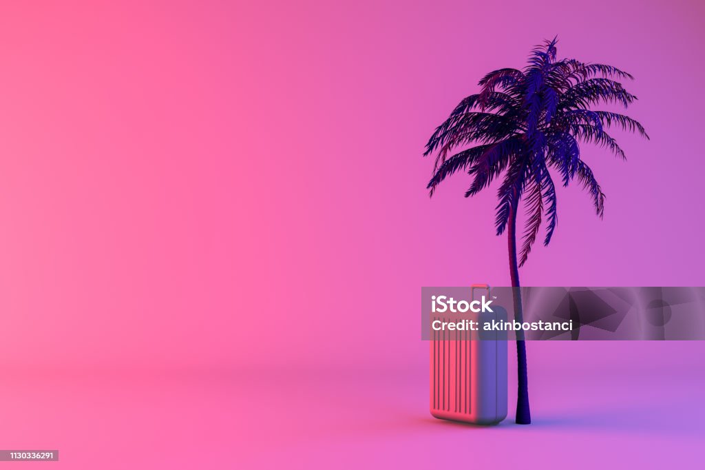 Palmera tropical y maleta en fondo de color neón, verano mínimo y viajes concepto - Foto de stock de Viajes libre de derechos