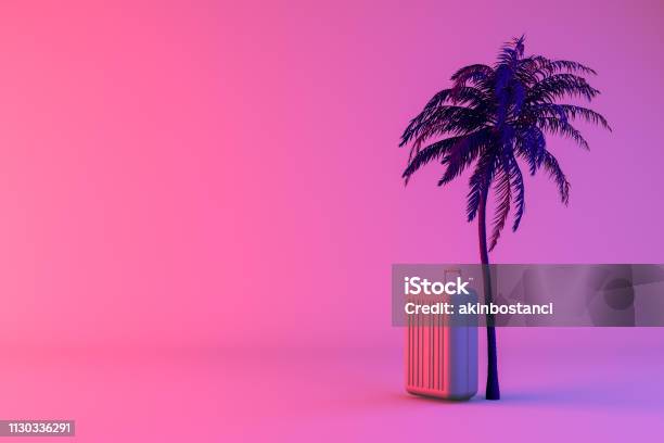 Tropical Palm Tree And Suitcase On Neon Color Background Minimal Summer And Travel Concept Stock Photo - Download Image Now