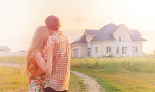 istock couple looking on house 1130338493