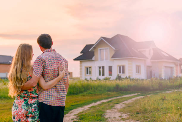 istock young couple near his house 1130338601