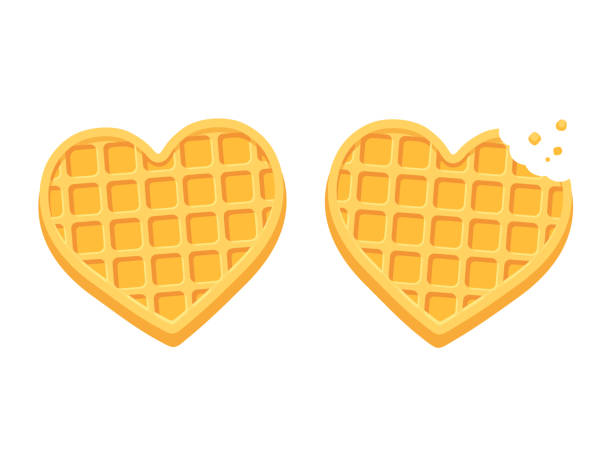 Heart shaped waffles Two heart shaped waffles, with bite and crumbs. Cute cartoon style vector illustration. waffle stock illustrations