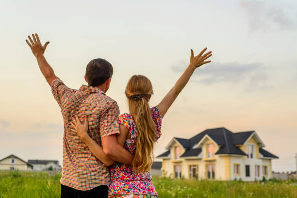 istock couple looking on house 1130339567