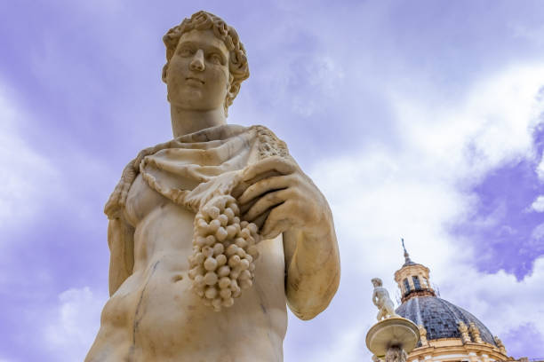 Statue of Dionysus or Bacchus with bunch of grapes stock photo