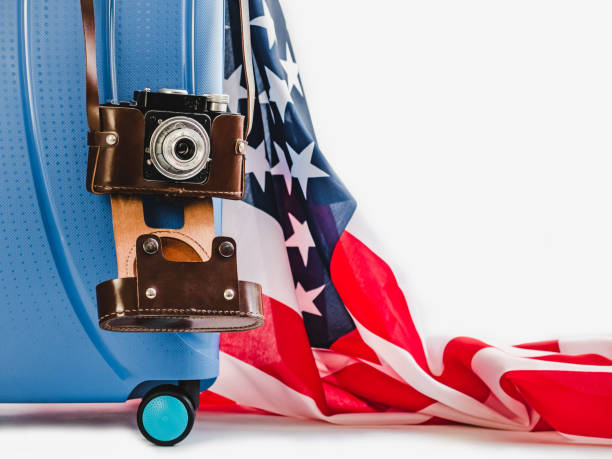 istock Stylish, blue suitcase, USA flag and vintage camera 1130342353