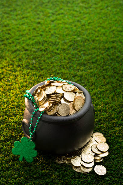 istock bucket of Gold on Grass for St. Patrick's Day 1130342430