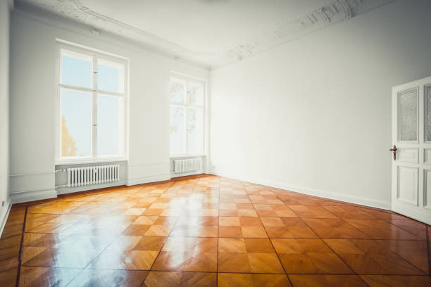 istock empty room, new flat old building wooden floor and stucco 1130345119