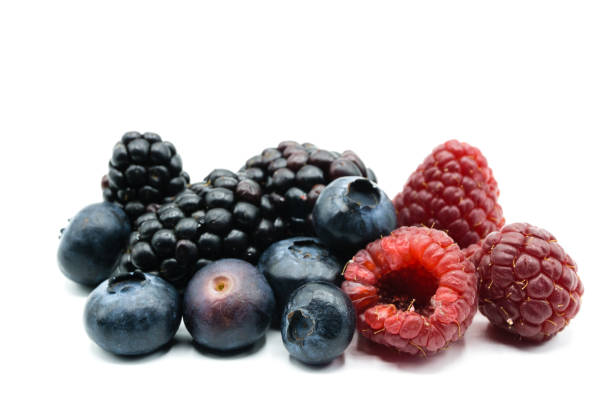 istock Blackberries raspberries and blueberries isolated on white background 1130345940