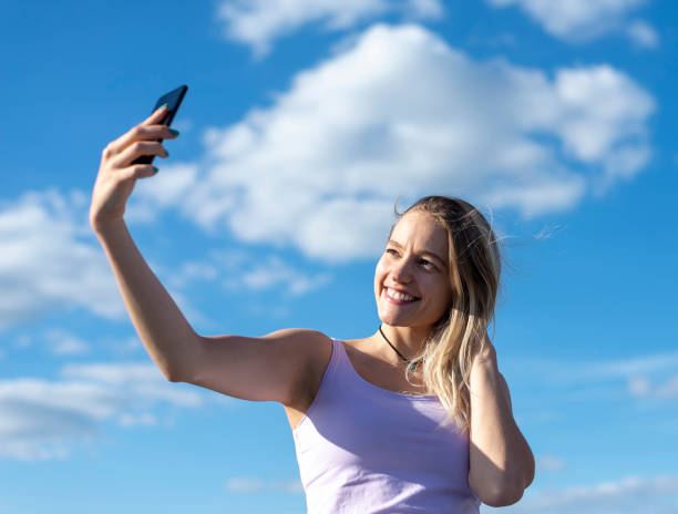 istock woman taking selfie with smartphone 1130347065