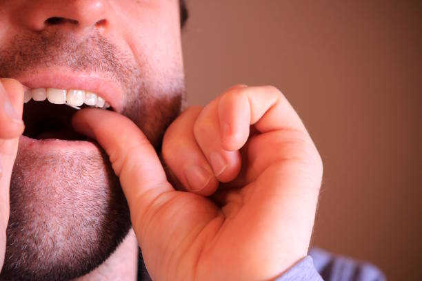 istock Mature man cleaning teeth with floss 1130347101