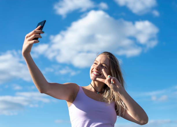 istock woman taking selfie with smartphone 1130347260
