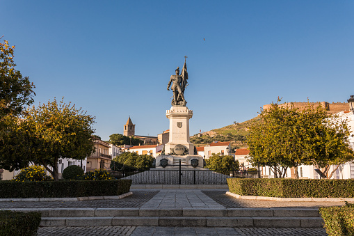 Medellin, Extremadura, Spain - February 13, 2019: Statue of Spanish conquistador Hernan Cortes in the plaza of the same name in Medellin, Extremadura, Spain. The foundations of the house in which the Spanish Conquistador Hernan Cortes was born, in the aquare of the same name in Medellin, have recently been found.