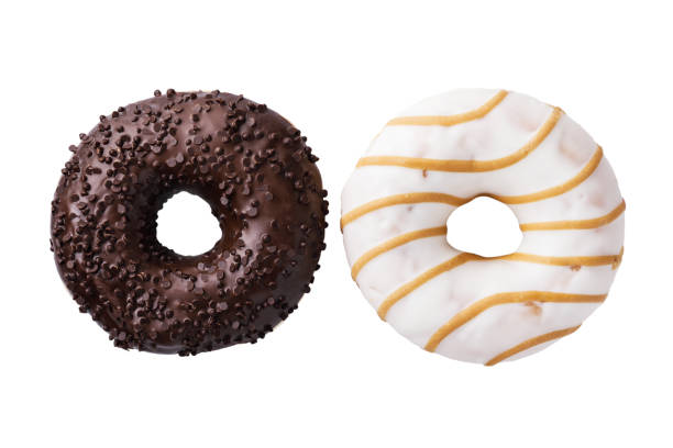 istock Chocolate and caramel donuts isolated on white background, top view 1130350893