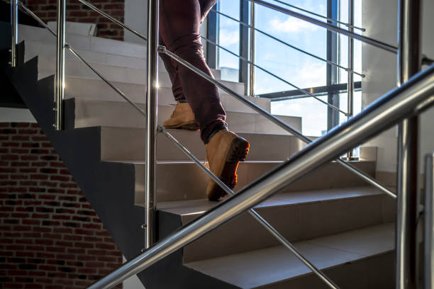 istock young man hurry and running up the stairs 1130351015