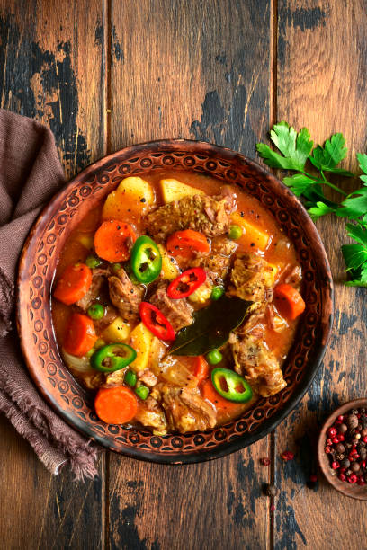 istock Meat stew with potato, carrot and green pea 1130351035