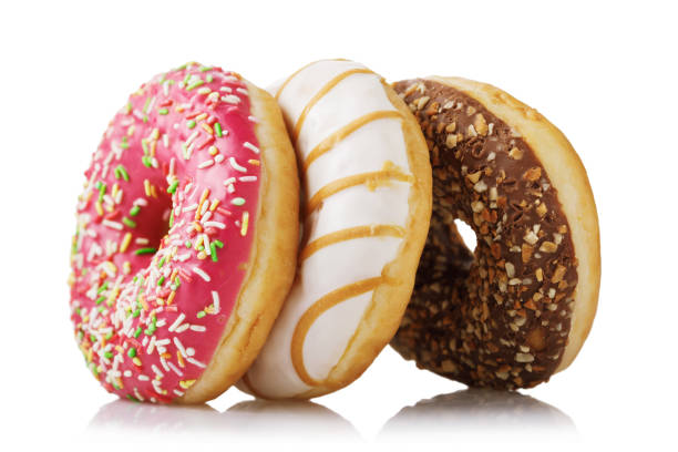 istock Three fresh donuts with various fillings isolated on white background 1130351066