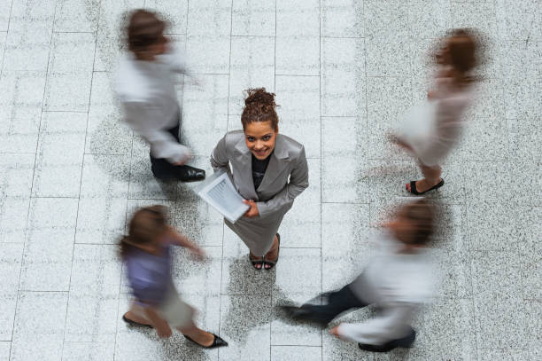 istock Young businesswoman with files 1130351104