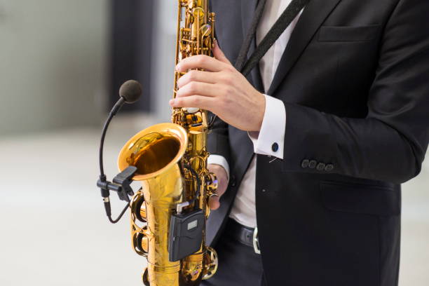 istock Saxophone in musician's hands. 1130351252