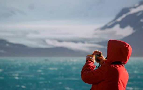 Woman ship view Antarctic Peninsula ice filled Woman ship view Antarctic Peninsula ice filled antarctic peninsula photos stock pictures, royalty-free photos & images