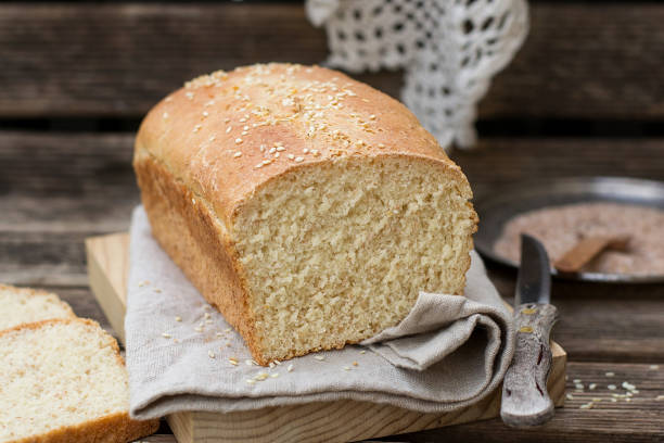 istock Loaf of white bread with wheat bran and sesame 1130352056