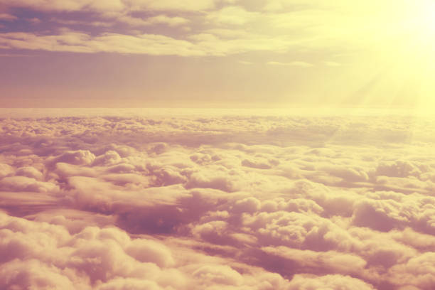 istock Heavenly cloudy landscape from a height of flight, warm toning processing 1130352412