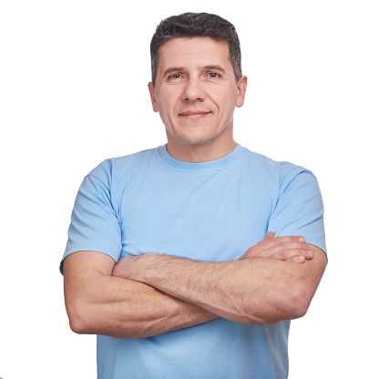 Portrait handsome man wearing blue informal t-shirt with folded arms isolated over white background