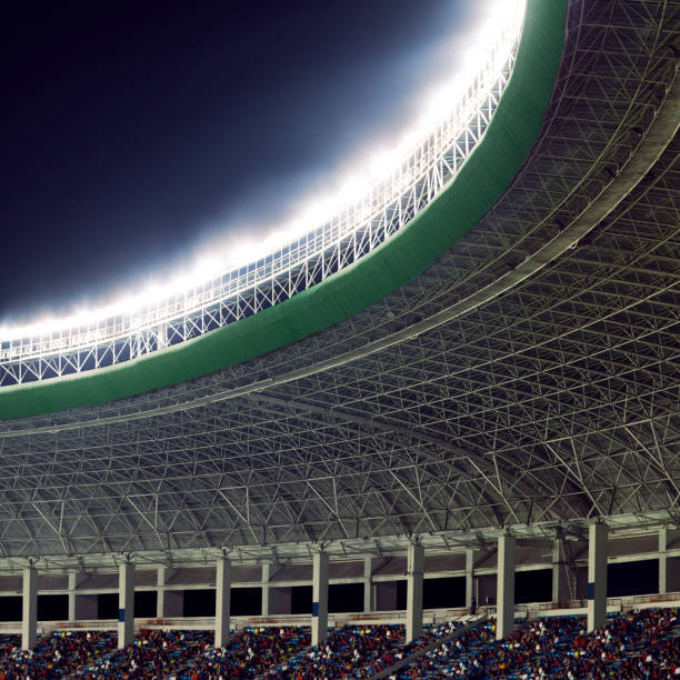 istock Spotlights and floodlights at a stadium at night 1130357004