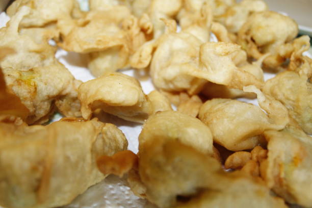 istock battered pumpkin flowers 1130359223