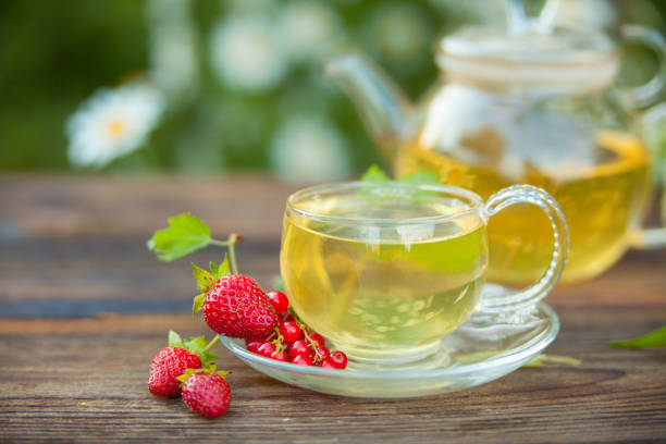 istock wild strawberry tea in beautiful cup 1130360491
