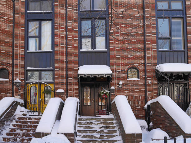 istock front steps of modern brick townhouses covered in snow 1130362368