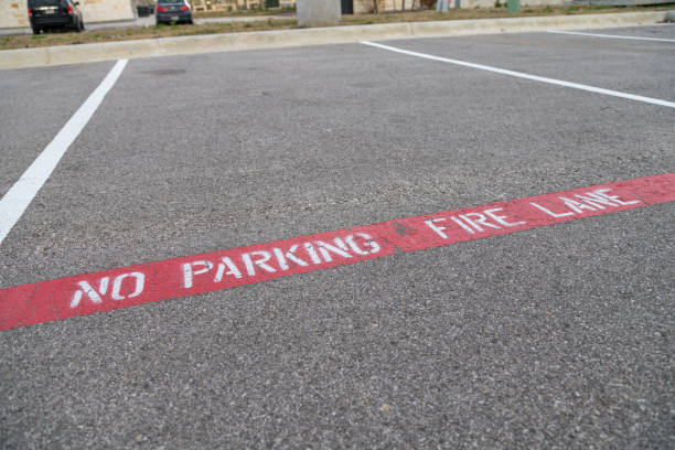 istock Close Up View of No Parking Painted on Concrete 1130362474
