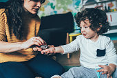 Mother Giving a Medicine to Child