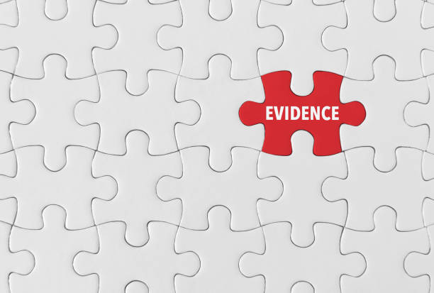 Evidence, Puzzle concept. Puzzle pieces with word 'Evidence’ manhunt law enforcement stock pictures, royalty-free photos & images