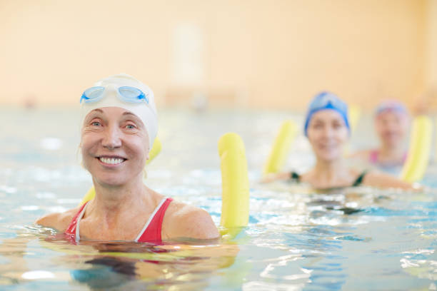 istock Happy Women Working Out in Water 1130365639