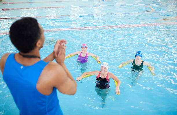 istock Fitness Class in Swimming Pool 1130365666