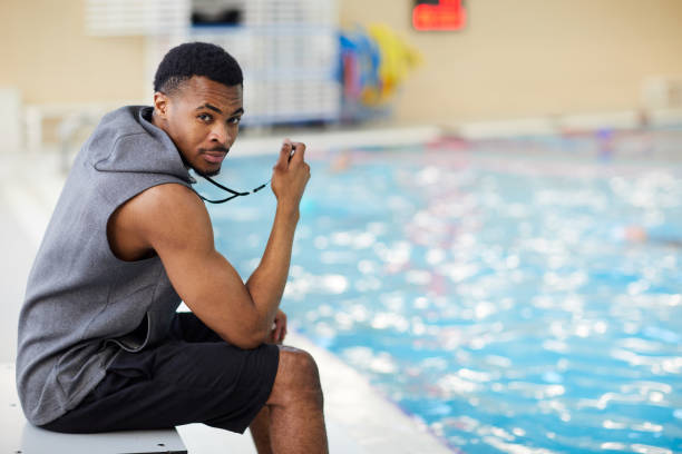 istock Handsome Fitness Instructor in Swimming Pool 1130365673