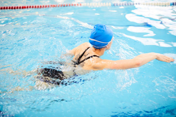istock Woman Swimming in Pool 1130365680