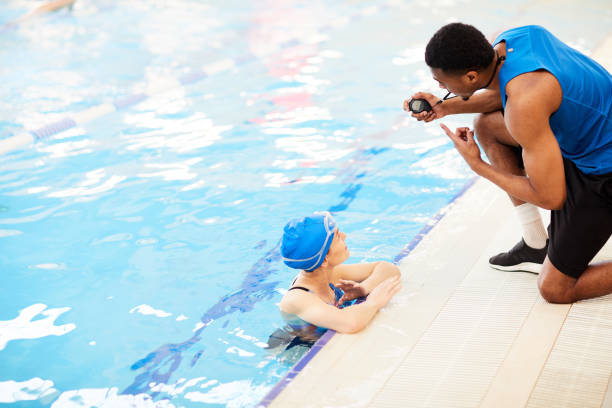 istock Woman Talking to Guard in Pool 1130365682