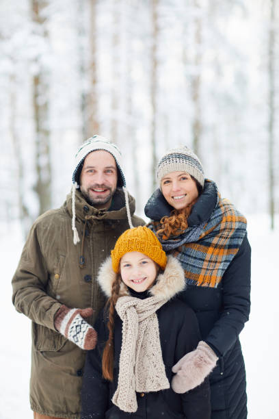 istock Happy Family in Winter Forest 1130366565