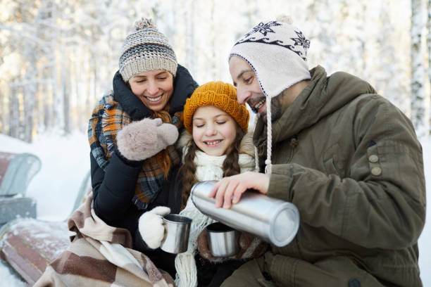 istock Family Drinking Cocoa in Park 1130366625