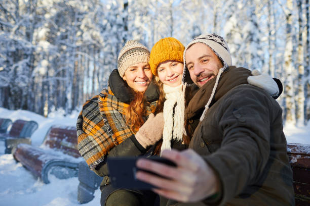 istock Family Taking Photo in Winter 1130366627