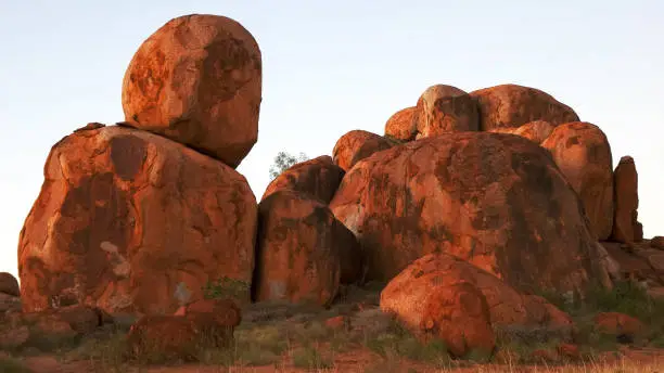 a close up shot of the devil's marbles in australia's northern territory at dusk