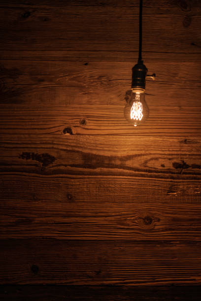 istock light bulb against a wooden background (HDRi) 1130370580