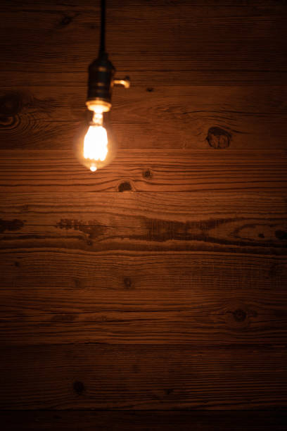 istock light bulb against a wooden background 1130370585