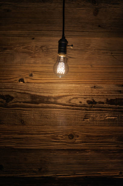 istock light bulb against a wooden background (HDRi) 1130370586