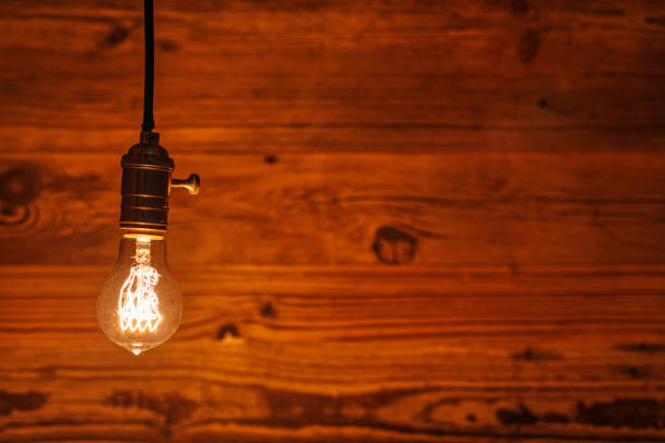 istock light bulb against a wooden background (HDRi) 1130370587