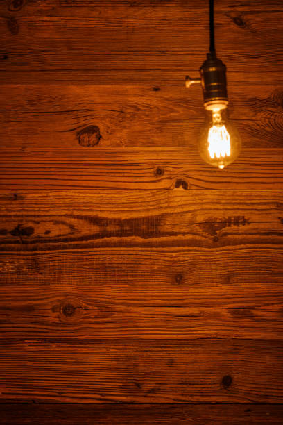 istock light bulb against a wooden background (HDRi) 1130370589