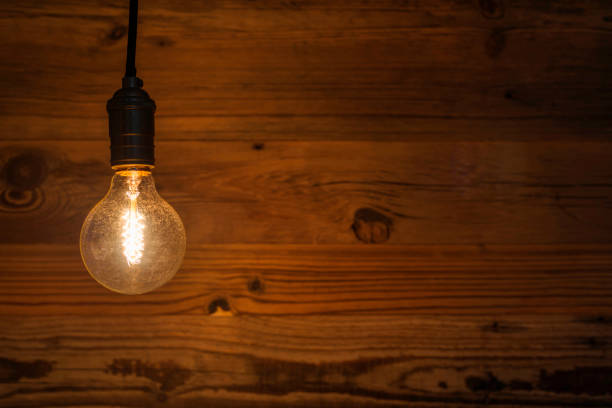 istock light bulb against a wooden background (HDRi) 1130370593