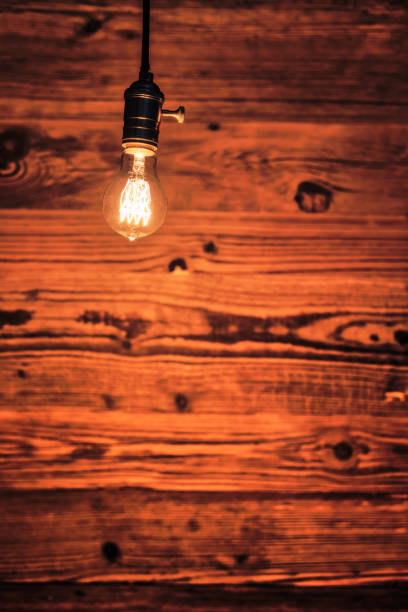istock light bulb against a wooden background (HDRi) 1130370596