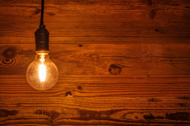 istock light bulb against a wooden background (HDRi) 1130370598