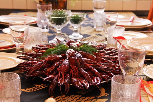 A table that is set for the traditional nordic party of fresh water crayfish